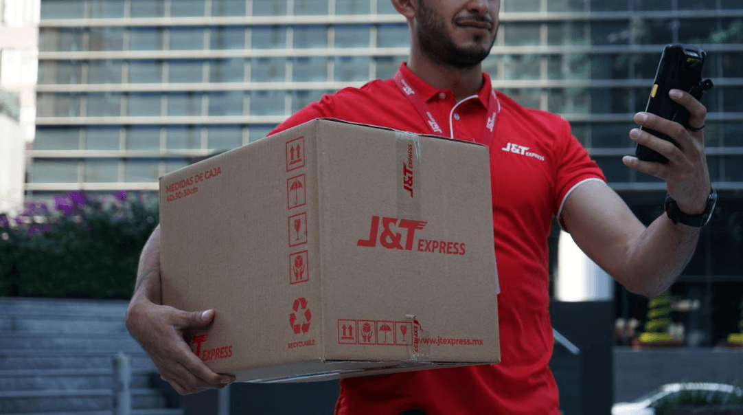 Delivery person holding J&T Express package